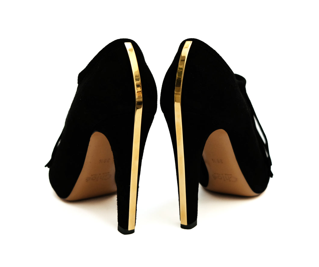 Black stilettos outlet with gold heels